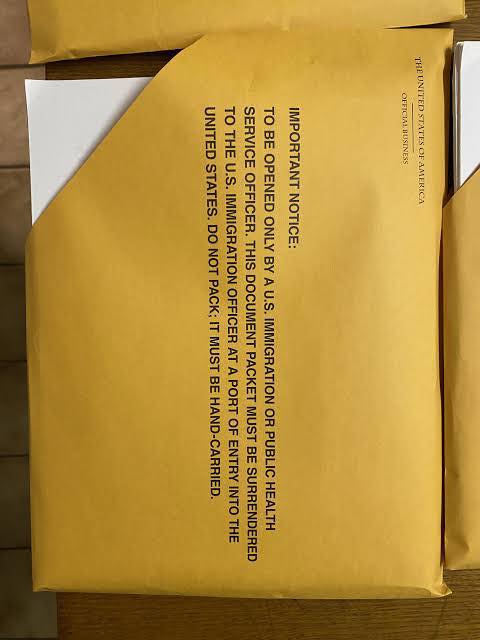 Awaiting that brown envelope with US immigrant visa packet by Frances Van Lare